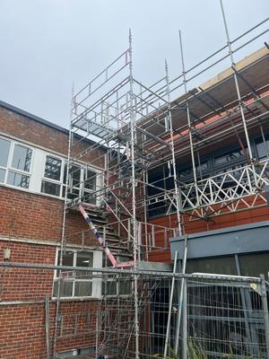 School complex scaffolding with staircase access tower