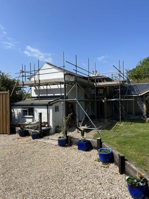 White cottage scaffolding for extension work