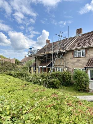 Stone house rear scaffolding for roof work