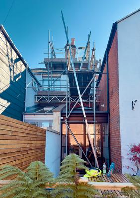 Modern townhouse rear scaffolding with garden